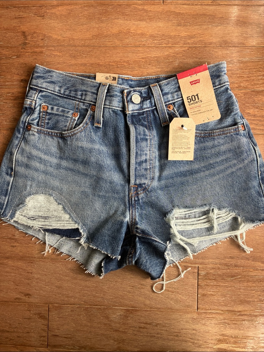 Levi's Distressed Denim Cutoff Shorts in Medium Blue